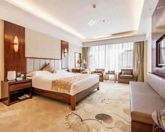 Jiusheng International Hotel - Gannán - Habitación