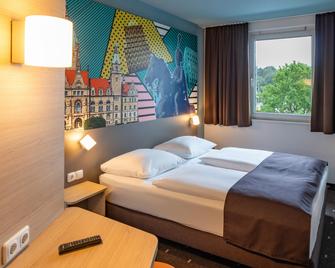 بد آند بريكفاست هوتل هانوفر لاهه - هانوفر - غرفة نوم