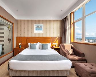 Qiyue Boutique Hotel (Hanzhong Nanzheng Dahekan Longgang School Branch) - Hanzhong - Slaapkamer