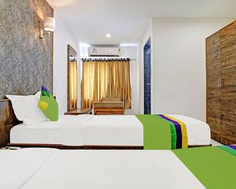 Treebo Varsha Palace - Aurangábád - Ložnice