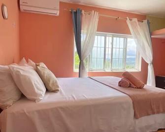 Skyline Suites Villa Peachy keen (Sofa bed) - Bahía Montego - Habitación