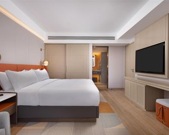 Home2 Het Jokhang Temple Hailiang Square - هوهيهوت - غرفة نوم