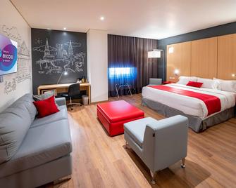Ramada Encore by Wyndham Guadalajara Aeropuerto - Guadalajara - Schlafzimmer