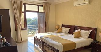 Hotel Nirvana Palace - Rishikesh - Yatak Odası