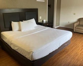 Posh Inn & Suites - Wisconsin Rapids - Спальня