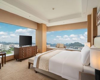 Guilin Exhibition International Boutique Hotel - Guilin - Schlafzimmer