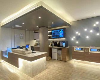Hanting Hotel Tianjin Dongli Sports Center Wa - Tianjin - Front desk