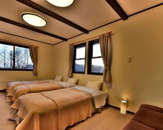 Petit Hotel Kanan - Chino - Habitación