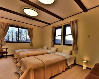 Petit Hotel Kanan - Chino - Slaapkamer