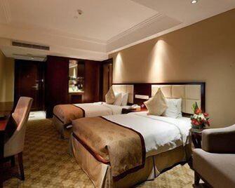 Oriental Deluxe Hotel - Hangzhou - Schlafzimmer