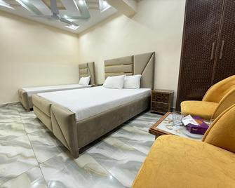 Serene Elegance Hotel - 伊斯蘭堡 - 臥室