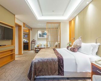 Nanchang Jin Feng Hotel - נאנצ'אנג - חדר שינה