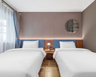 Home Inn Neo Shanghai Quyang Business Center Dabaishu Metro Station - Shangai - Habitación