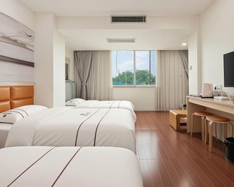 Xinzhou Hotel - גואנגג'ואו - חדר שינה