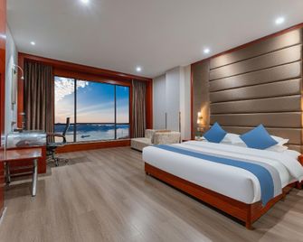 Kaisheng Meiji Hotel (Yichang Binjiang Branch) - Yichang - Schlafzimmer