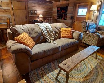 Get away from it all! Restored 1800 log cabin on 40 acres - NO cleaning fee! - Blue Creek - Living room