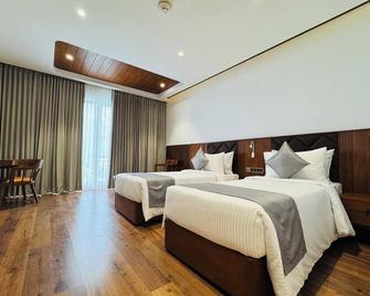 Gokulam Grand Kozhikode - Kozhikode - Schlafzimmer