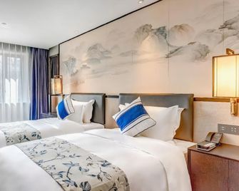 Rezen Dong Hotel (Harbin Railway Station) - Harbin - Bedroom