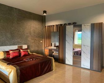 Ban Tham Hil Hotel - Mae Sai - Schlafzimmer