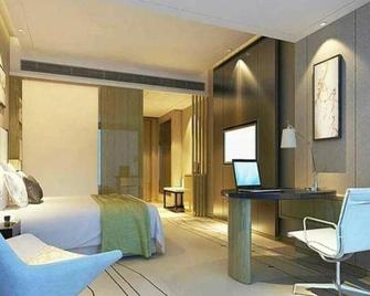 Vienna International Hotel Foshan World of Flower - Foshan - Schlafzimmer