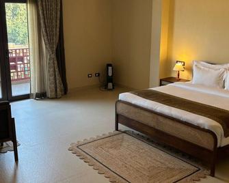 Kashi Anandam Spiritual & Wellness Vedic Village - Varanasi - Schlafzimmer