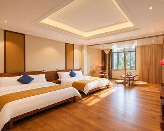 Liaokuo Jingshe Hotel - Qujing - Bedroom