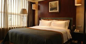 Ourland Airport Business Hotel - Chongqing - Bedroom