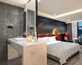 Themove River View Hotel -Chongqing Jiefangbei Hongyadong Branch - Tsjoengking - Slaapkamer