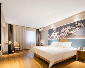Magnotel Business Changchun Convention & Exhibition Center - Changchun - Habitación