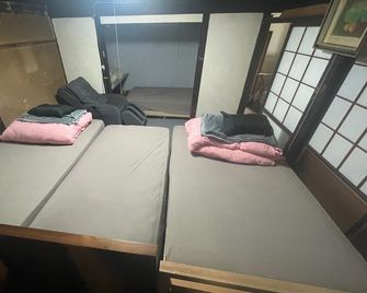 Guest House Gakidaisho - Ōmachi - Schlafzimmer