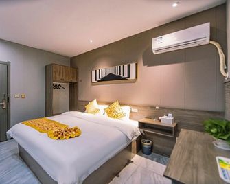 Orange Blossom Boutique Hotel (Jingzhou Hongxing Road Food Street Branch) - Jingzhou - Bedroom