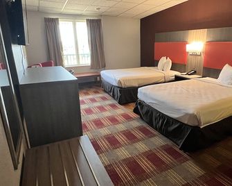 Countryside Suites Kansas City Independence I-70 East Sports Complex Hotel - Independence - Спальня