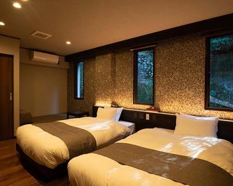 هوتل كيكونويا - هاتسوكايتشي - غرفة نوم