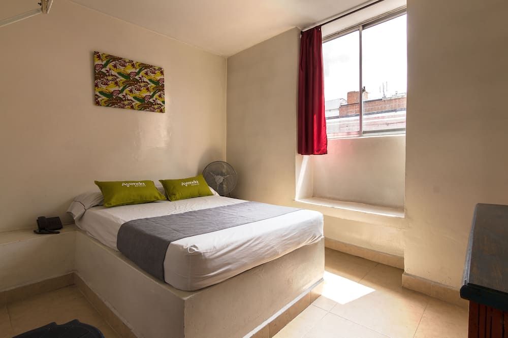 هوتل كونكيستادوريس - ميديلين - غرفة نوم