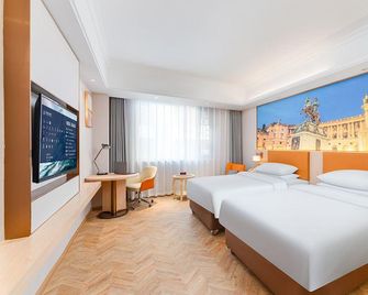 Vienna Hotel Xishuangbanna Gaozhuang Starlight Night Market - Xishuangbanna - Schlafzimmer