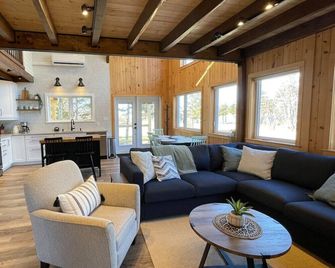 Chalet Gedouque, a tranquille retreat located on the Cabot Trail with waterfront views - Cheticamp - Living room