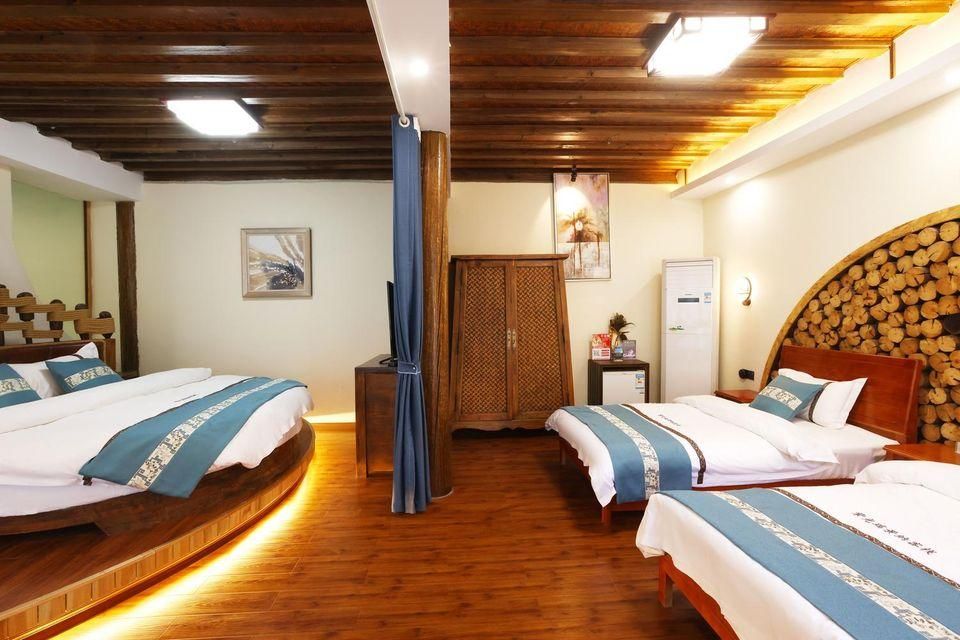 Ziguang Ruijingna Boutique Inn - ליז'יאנג - חדר שינה