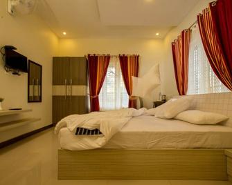 Girassol Service Villa - Vythiri - חדר שינה