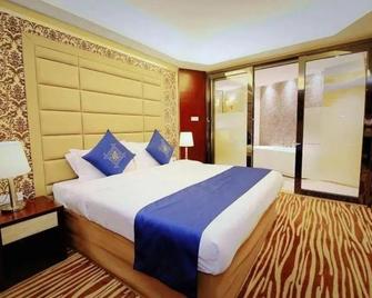 Dongguan Jun Hao Hotel - Dongguan - Ložnice