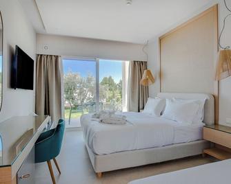 Colonides Beach Hotel - Vounaria - Спальня