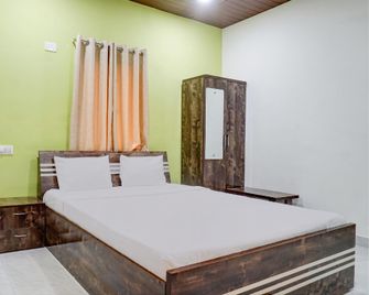 Hotel O Mango Tree Lodging - Пуна - Спальня