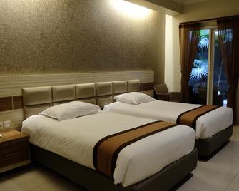 De'Corner Guest House - Malang - Bedroom
