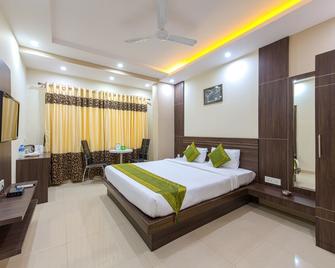 Treebo Globe International - Kolkata - Bedroom