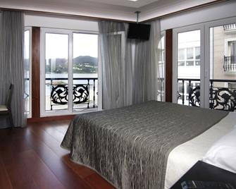 Hotel As Areas III Playa - Covas - Camera da letto