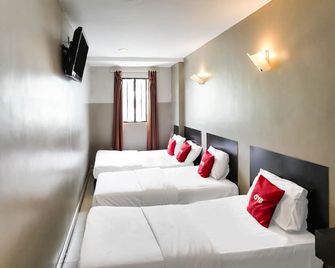 Hotel O 365 Nice Stay - Мірі - Спальня