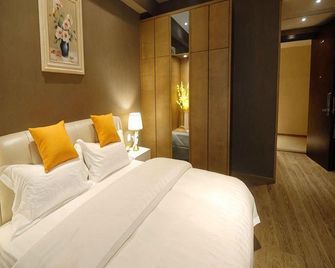 Jiuwei Boutique Apartment (Nanjing Children's Hospital Shenglonghui Gold Store) - Nanjing - Makuuhuone