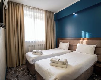 Mildom Express - Almatý - Habitación