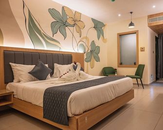 Hotel Tamizh Grand - Pondicherry - Schlafzimmer