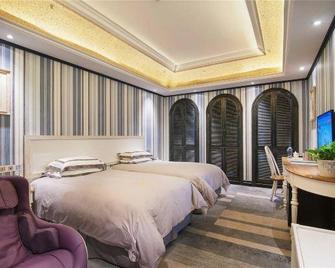 Caesar International Hotel - Huzhou - Schlafzimmer