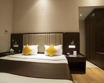 Hotel Rajhans Abhinandan - Bhopal - Schlafzimmer